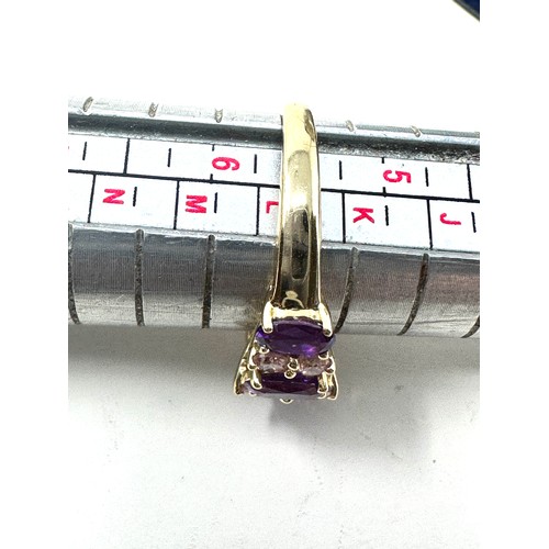 234 - 9ct gold purple sapphire & pink gemstone dress ring (2.4g)