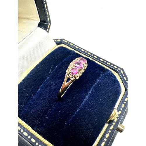 267 - 9ct gold ruby three stone ring (1.2g)