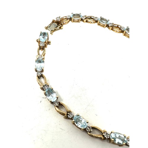 290 - 9ct gold diamond & topaz  bracelet (7.9g)