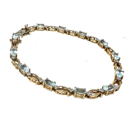 290 - 9ct gold diamond & topaz  bracelet (7.9g)