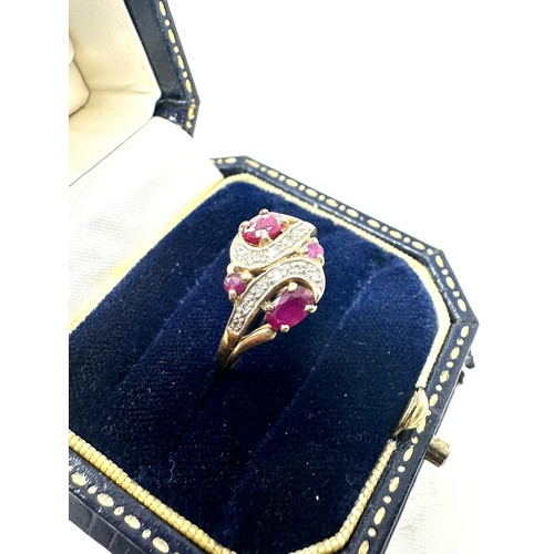 288 - 9ct gold diamond & ruby dress ring (2.2g)