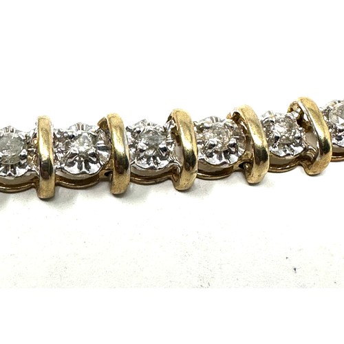 194 - 10ct gold diamond tennis bracelet (8.2g)