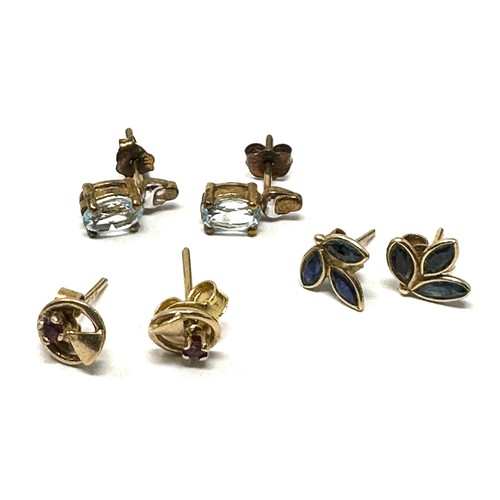 115 - 3 x 9ct gold paired gemstone stud earrings inc. ruby, sapphire & topaz (2.4g)
