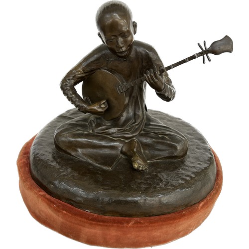 Bronze figure of a boy playing the Mandolin on a detachable fabric base, marked Fonderi Tonknoise Hoang- Xian -lan - Hanor, approximate measurements: Height 13 inches, diameter: 14 inches