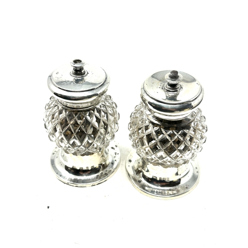 1 - pair of silver & cut glass pepper mills birmingham silver hallmarks