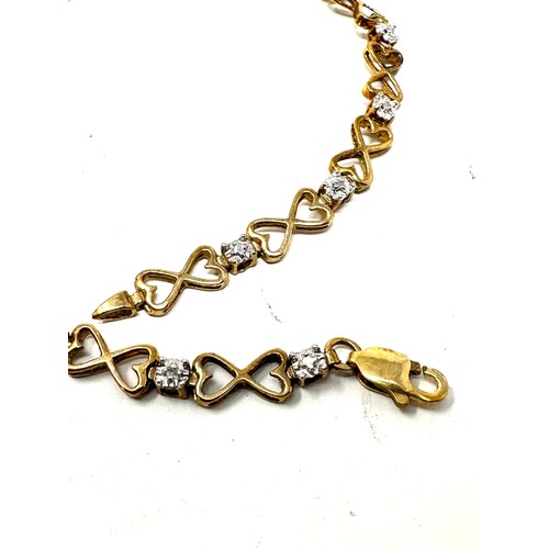 210 - 9ct gold diamond heart link tennis bracelet (4g)