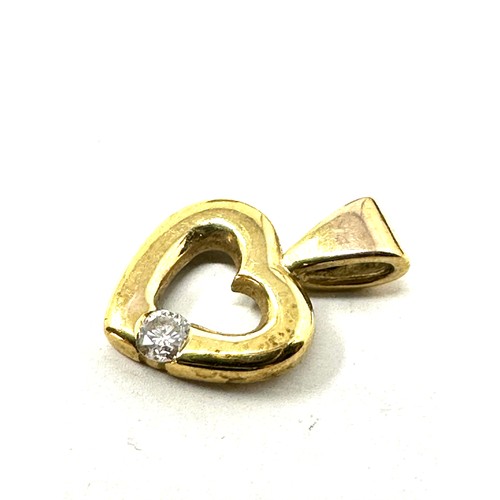 214 - Small 9ct gold diamond heart pendant (0.5g)