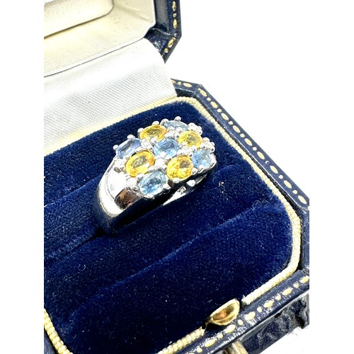 193 - 9ct white gold sapphire & yellow sapphire dress ring with diamond accents (5.3g)