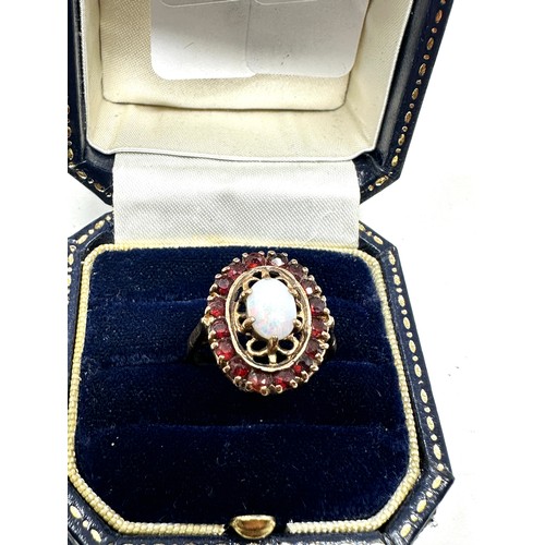 175 - 9ct gold opal & garnet halo ring (3.6g)