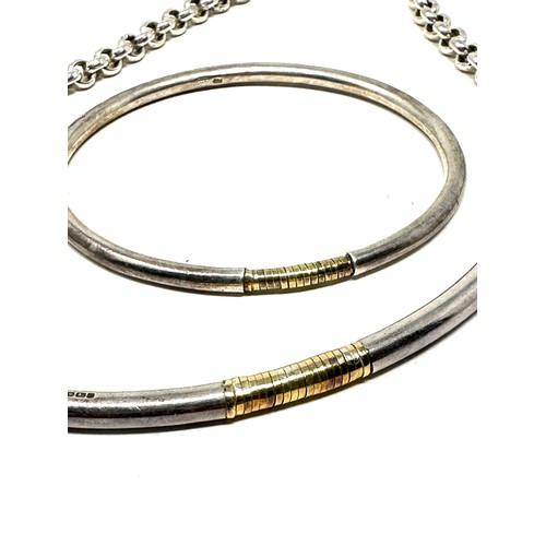 229 - 15ct gold and silver modernist bangle and necklace set (74g)