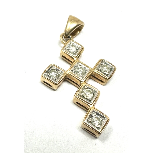 128 - 9ct gold diamond cross pendant 1.6g