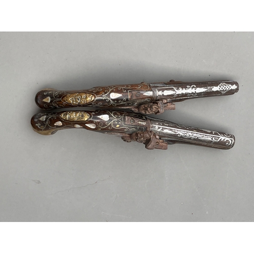 83 - Two Antique Ottoman silver & mother pf pearl flintlock pistols 19th century approx length 30cm