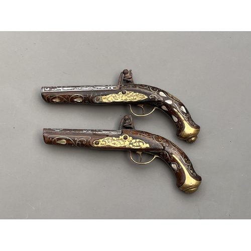 83 - Two Antique Ottoman silver & mother pf pearl flintlock pistols 19th century approx length 30cm