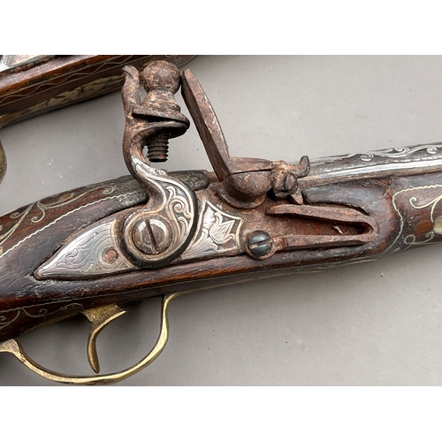 83 - Two Antique Ottoman silver & mother pf pearl flintlock pistols 19th century approx length 30cm