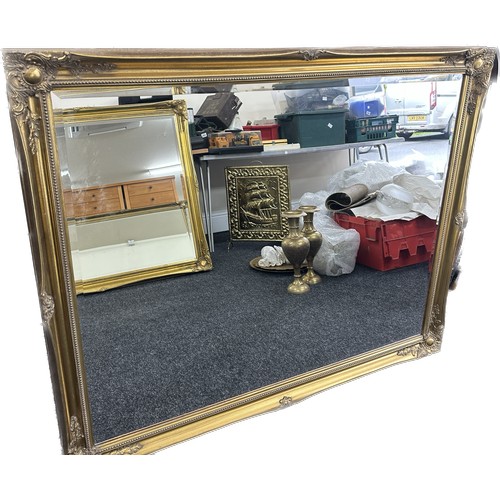 589 - Large beveled edge gilt framed mirror measures approximately 128cm wide 116cm tall