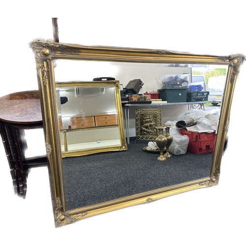 589 - Large beveled edge gilt framed mirror measures approximately 128cm wide 116cm tall