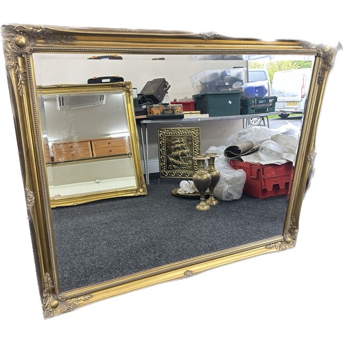 589 - Large beveled edge gilt framed mirror measures approximately 128cm wide 116cm tall