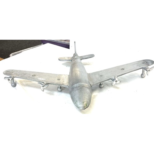 62 - Cast aluminum plane model measures approximately 19 inches depth 25 inches wide