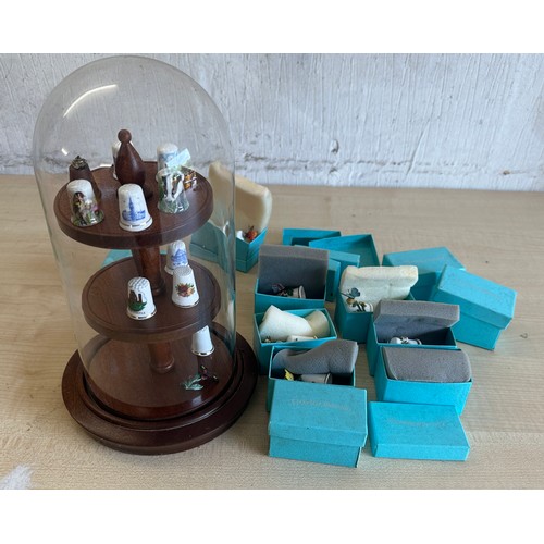 252 - A glass dome thimble display case and a selection of boxed thimbles called ' World of Butterflies' a... 