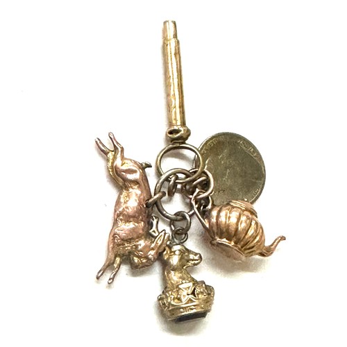 398 - Selection of gold/ gold coloured charms includes tea pot, rabbit and a deer