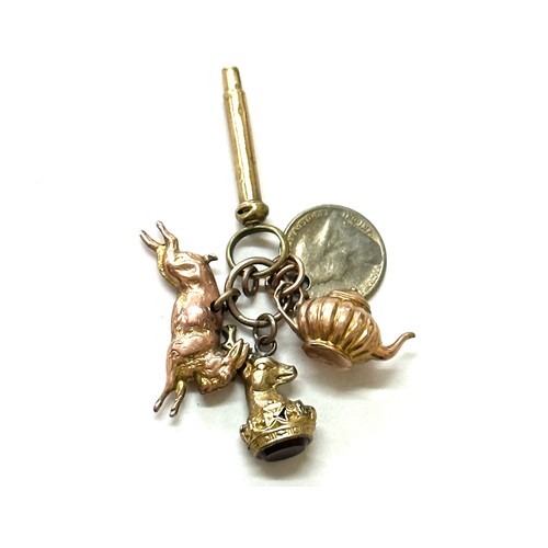 398 - Selection of gold/ gold coloured charms includes tea pot, rabbit and a deer