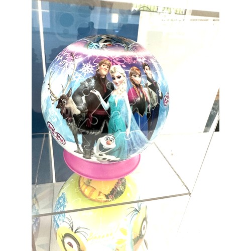 19 - Perspex show case with four 3d puzzles includes Minions etc