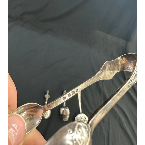 309 - Silver sugar tongs, 2 Novelty spoons etc