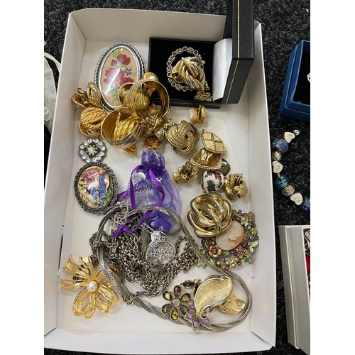 304 - Selection of assorted costume jewellery includes Charms, brooches, clip in earrings etc