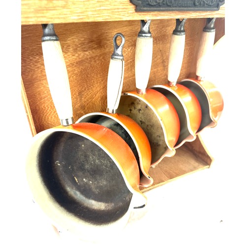 73 - Le Creuset pan and  set with wooden Le Creuset hanging stand, split to one of the wooden handles