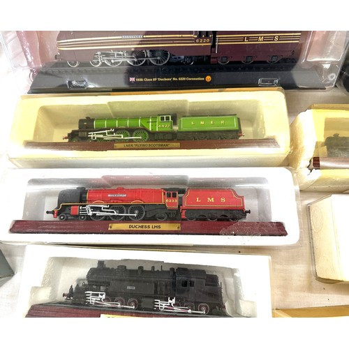 64 - Selection of various railway models on display plinths to include Duchess LMS, LNER flying Scotsman,... 