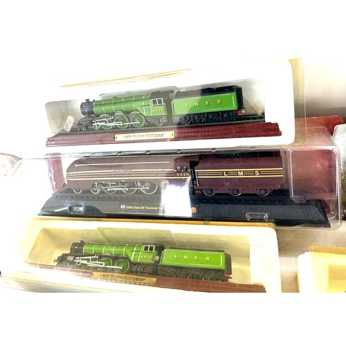 64 - Selection of various railway models on display plinths to include Duchess LMS, LNER flying Scotsman,... 