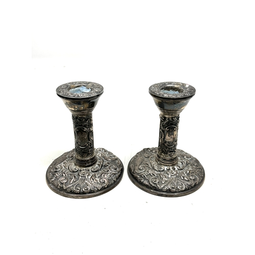 105 - Pair of antique silver candlesticks measure height 10cm