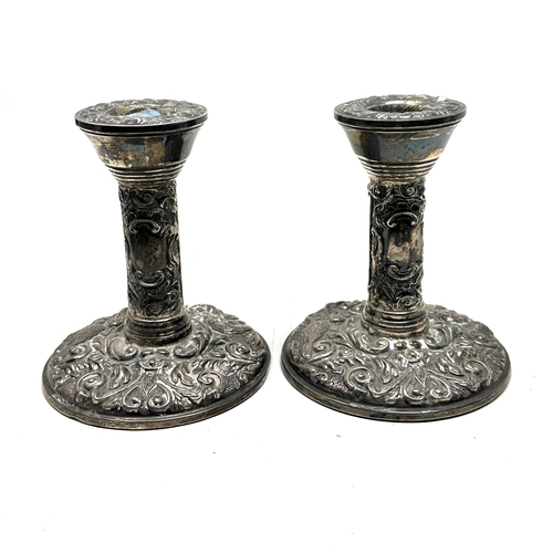 105 - Pair of antique silver candlesticks measure height 10cm