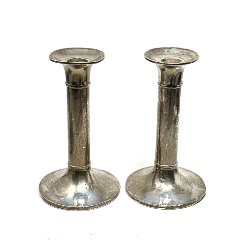 112 - Pair of silver candlesticks measure approx height 15.5cm