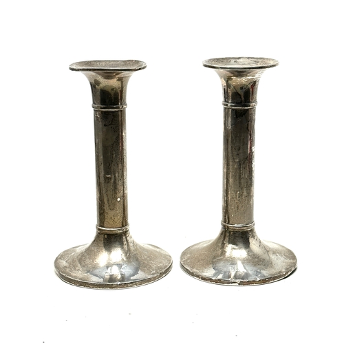 112 - Pair of silver candlesticks measure approx height 15.5cm