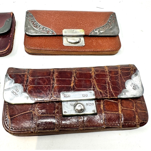 144 - 4 antique silver mounted leather purses