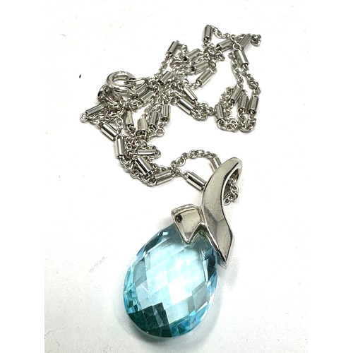 272 - 9ct white gold blue faceted topaz pendant necklace (6g)