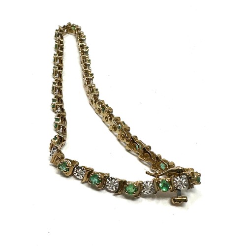 267 - 9ct gold emerald & diamond tennis bracelet (6.3g)