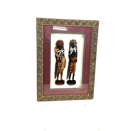 41 - Framed native American figures measures approximately 21inches by  15inches