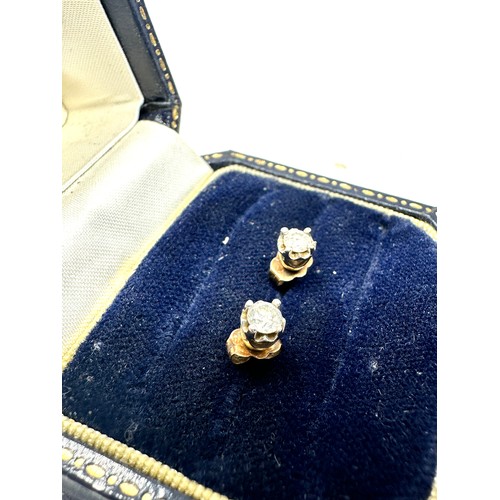 309 - 9ct gold diamond stud earrings (0.7g)