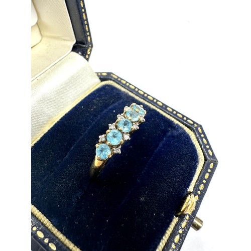 274 - 9ct gold blue topaz & diamond  ring (1.5g)