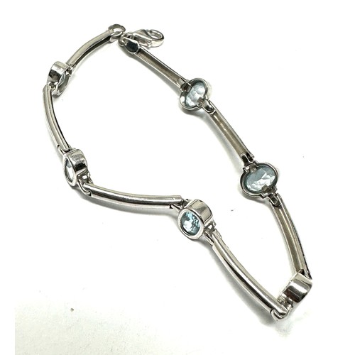 259 - 9ct white gold blue topaz bracelet (6g)