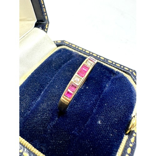 320 - 9ct gold ruby & diamond channel setting ring (2.1g)