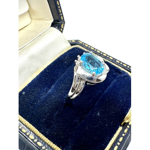 319 - 9ct white gold blue topaz & diamond ring (3g)