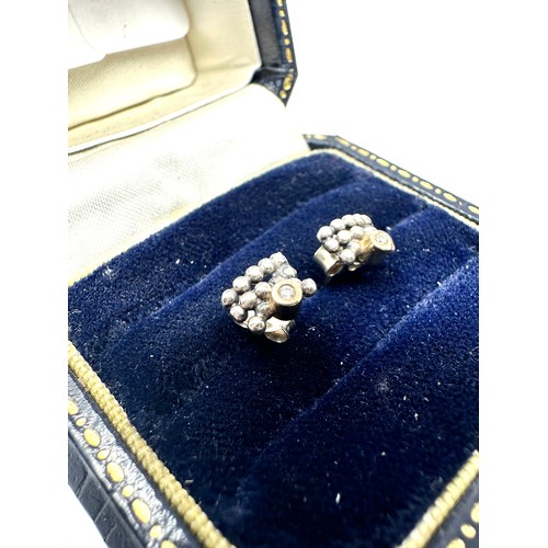 276 - 9ct gold and silver diamond stud earrings (1.2g)