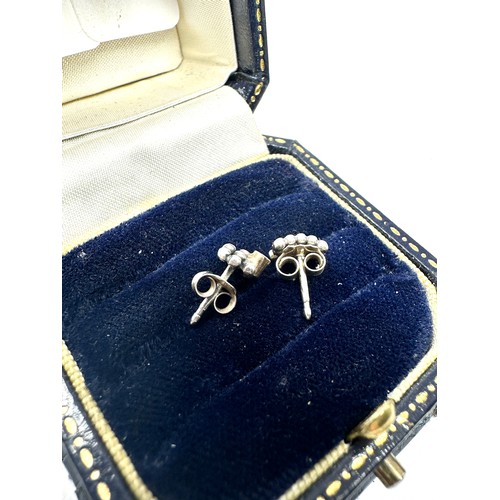 276 - 9ct gold and silver diamond stud earrings (1.2g)