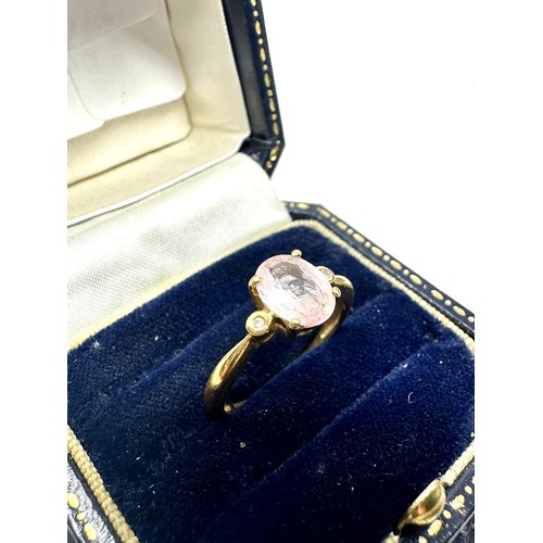 197 - 18ct gold diamond and oval pink sapphire ring (2.7g)