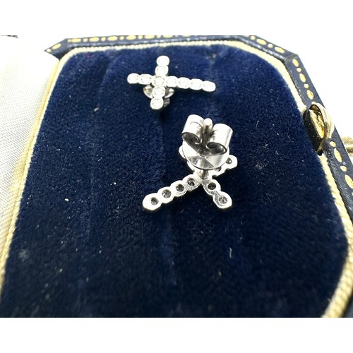 194 - 18ct white gold diamond paved cross stud earrings (1.6g)