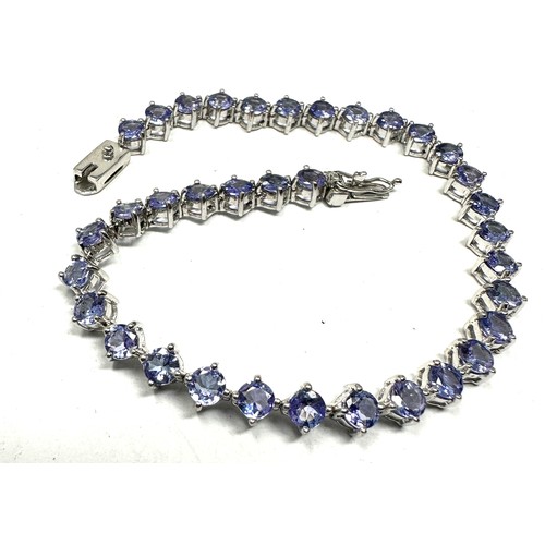 385 - 9ct white gold tanzanite tennis bracelet (12.7g)