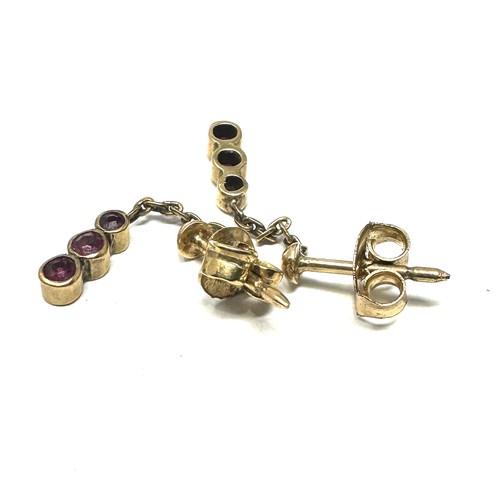 228 - 9ct gold ruby three stone drop earrings (1.3g)